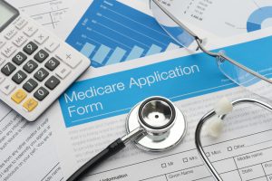 Medicare application form with stethoscope